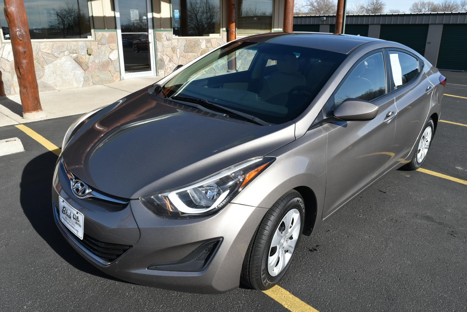 2016 Bronze Hyundai Elantra SE (5NPDH4AE3GH) with an 1.8L 4 Cyl engine, 6-Speed Automatic transmission, located at 1600 E Hwy 44, Rapid City, SD, 57703, (605) 716-7878, 44.070232, -103.171410 - Photo #2